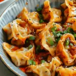 Chicken Wontons in Spicy Chili Sauce